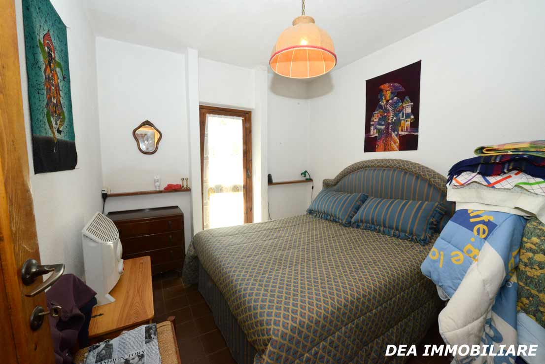 Camera da letto-matrimoniale-appartamento-residence-poggio-dei-pini
